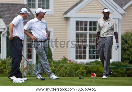 CROMWELL, CT - JUNE 25: Golfers Campbell, Glover, and Singh wait to tee off at Travelers Championship on the TPC River Highland Golf Course June 25, 2009 in Cromwell, CT.