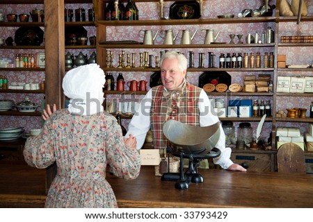 OLD STURBRIDGE VILLAGE, MA - JULY 15: Period actors recreate working in a general store for visitors  in Old Sturbridge Village, MA.