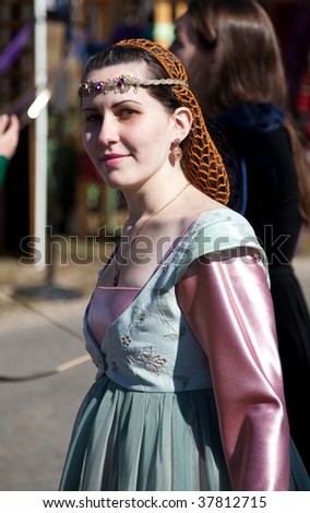 HEBRON, CT - SEPTEMBER 26 :  Unidentified woman portrays a Renaissance bridesmaid at the opening day of the Connecticut Renaissance Faire September 26, 2009 in Hebron, CT.