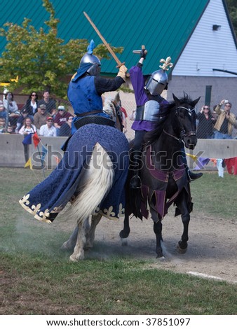 HEBRON, CT - SEPTEMBER 26: Knights sword fight on horseback at the opening day of the Connecticut Renaissance Faire September 26, 2009 in Hebron, CT.