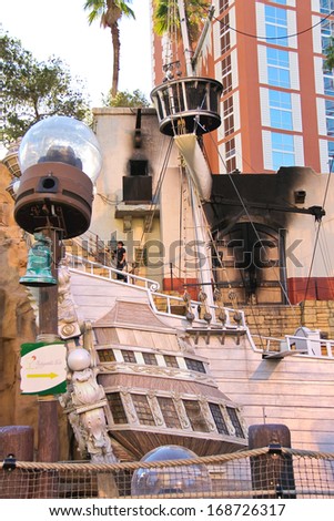 LAS VEGAS, NEVADA, USA - OCTOBER 20 : Pirate ship at pond near Treasure Island hotel on October 20, 2013 in Las Vegas. This Caribbean themed resort has an hotel with 2,884 rooms
