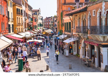 VENICE, ITALY - MAY 06, 2014: Lively trading in the market one of streets of Venice, Italy