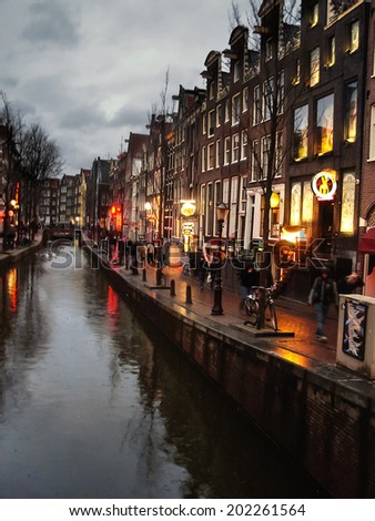 AMSTERDAM,THE NETHERLANDS - FEBRUARY 18, 2012 :   The famous street red light district in Amsterdam. Netherlands