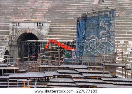 VERONA, ITALY - MAY 7, 2014: Workers install a theatrical stage for the annual festival of opera at the Arena Verona