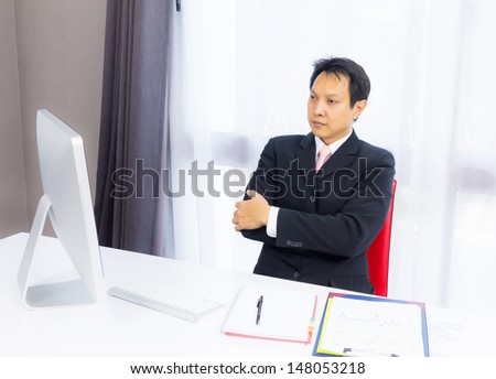 business man looking with desktop computer