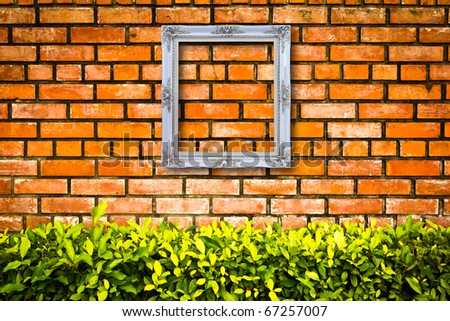 white picture frame on brick wall