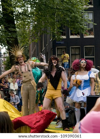 AMSTERDAM, HOLLAND - AUGUST 4, 2012: People celebrating on boats in the canals during the Gay Parade Aug. 4, 2012 in Amsterdam. The Gay Parade is held to celebrate and for awareness for gay people