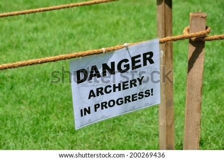 Archery in progress warning sign