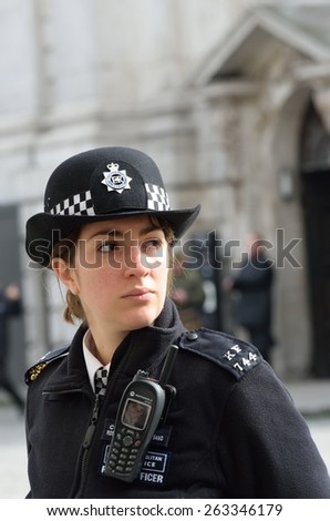 CITY OF LONDON ENGLAND 13 March 2015: Policewoman on duty
