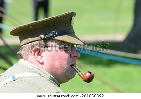 CRESSING TEMPLE ENGLAND 17 May 2015: Man in reenactment uniform enjoying a pipe