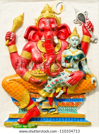 God of success 19 of 32 posture. Indian style or Hindu God Ganesha avatar image in stucco low relief technique with vivid color,Wat Samarn, Chachoengsao,Thailand.
