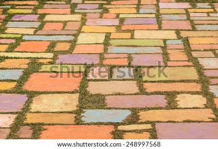 decorative colorful concrete floor on green grass background