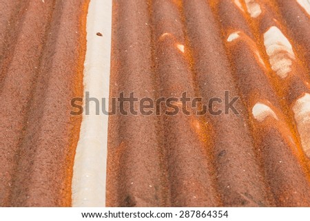 close up a rusty corrugated iron metal sheet texture of old roof on building