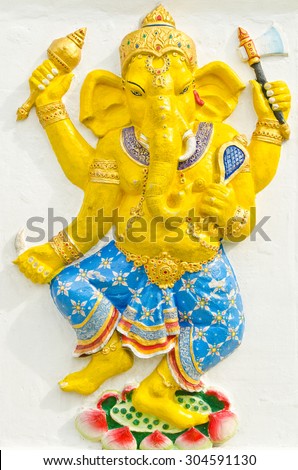 God of success 31 of 32 posture. Indian style or Hindu God Ganesha avatar image in stucco low relief technique with vivid color,Wat Samarn, Chachoengsao,Thailand.