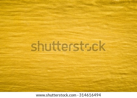 close up background and texture of gold color paint on wall