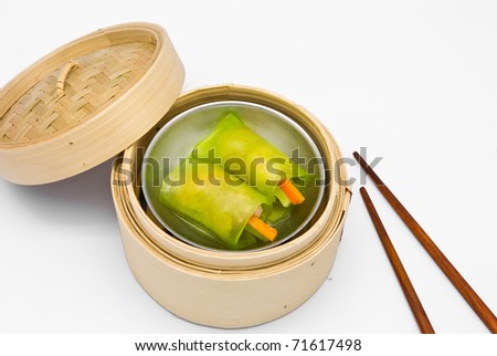 Chinese steamed dimsum green noodle in bamboo containers traditional cuisine