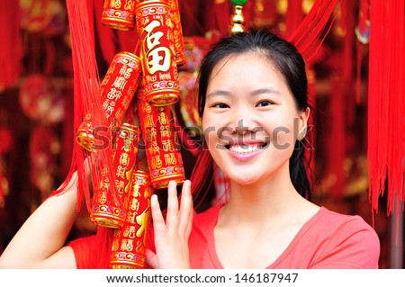young woman wishing a happy chinese new year