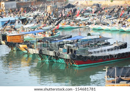 HUIDONG,GUANGDONG/ CHINA - SEPTEMBER 08: Fishing village/boats at shuangyuewan harbor in China. Fishing is the major income source of people living there, on September 08,2013 in Huidong city, China