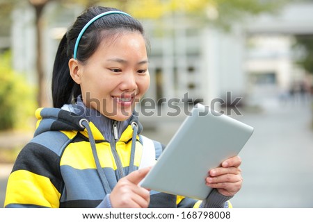 college student use tablet pc in campus