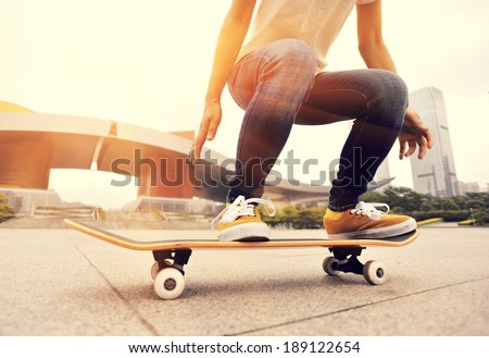 skateboarding woman in the city