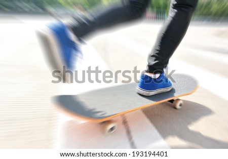 speeding skateboarding woman on zebra crossing road