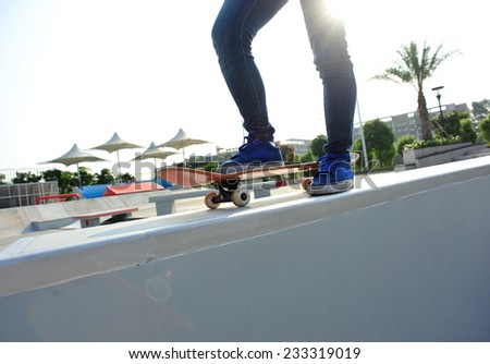 skateboarding woman legs