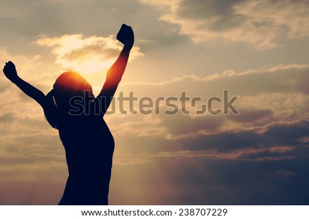 Strong confidence woman open arms under the sunrise at seaside  Stock foto © 