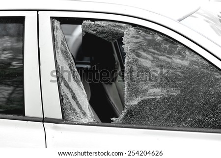 car window smashed by a thief