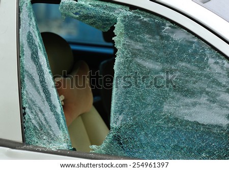 car window smashed by a thief