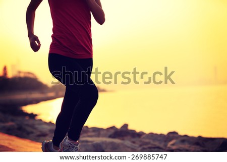 fitness woman running at seaside. woman fitness silhouette sunrise jogging workout wellness concept.