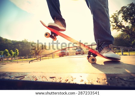 skateboarder legs skateboarding at skatepark ramp,vintage effect