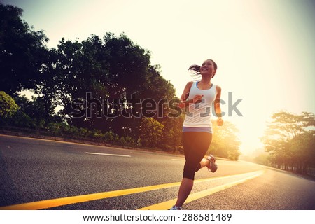 Runner athlete running at road. woman fitness sunrise jogging workout wellness concept.vintage effect