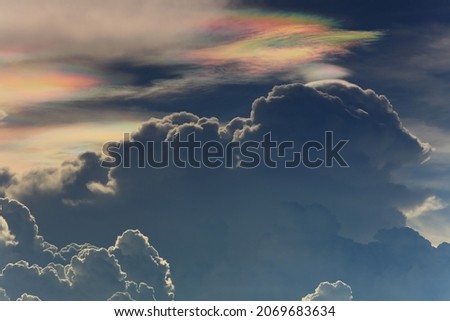 Iridescent Cloud (Cloud iridescence) or irisation is a colorful optical phenomenon that occurs in a cloud.
The colors are usually pastel, but can be very vivid or mingled together. Photo stock © 
