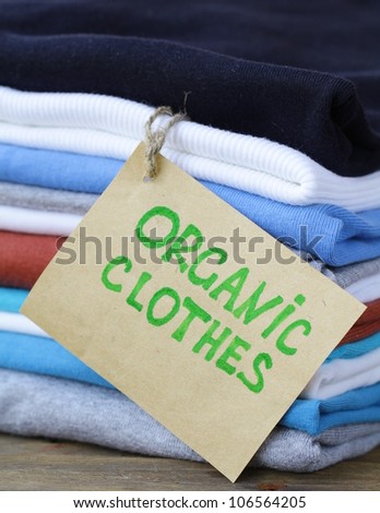 organic label  with  stack of colorful clothing