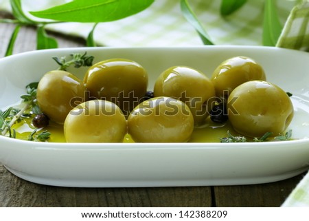 green olives with fragrant oil and spices