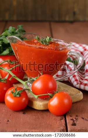traditional tomato sauce in a glass gravy boat