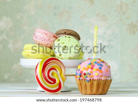 birthday cupcake with a candle and holiday desserts