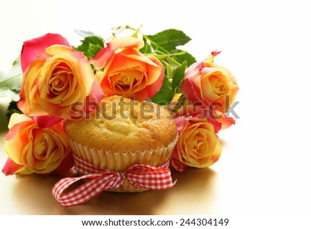 cake muffin with a bouquet of roses - sweet gift