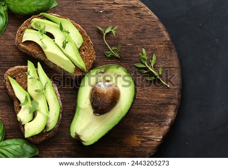 Similar – Image, Stock Photo Vegan sandwich with avocado in male hands