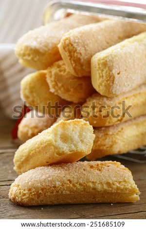traditional Italian biscuit cookies savoryadi (for tiramisu) on a wooden table