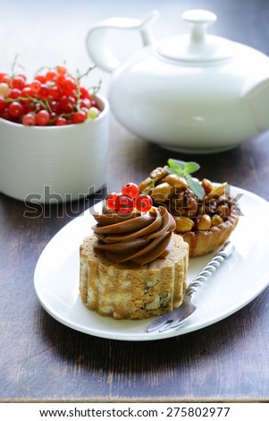 small dessert pastries with nuts and berries for tea time