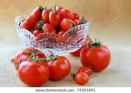 different varieties of tomatoes in a crystal vase