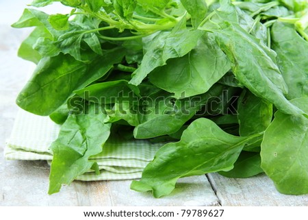 green fresh spinach on a wooden table, Organic Style