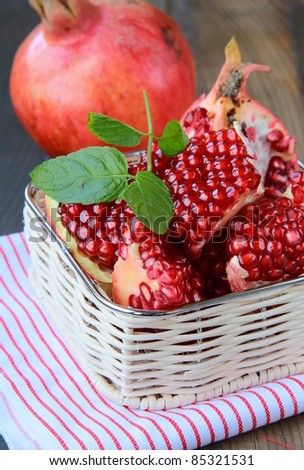 Pomegranates, whole and cut open