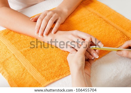 closeup picture of manicure process on female hands