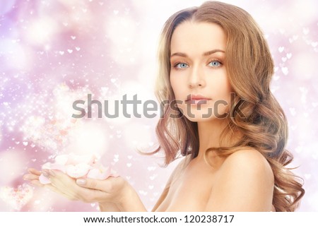 picture of beautiful woman with rose petals and hearts.