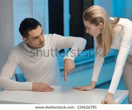 picture of man and woman working with something imaginary