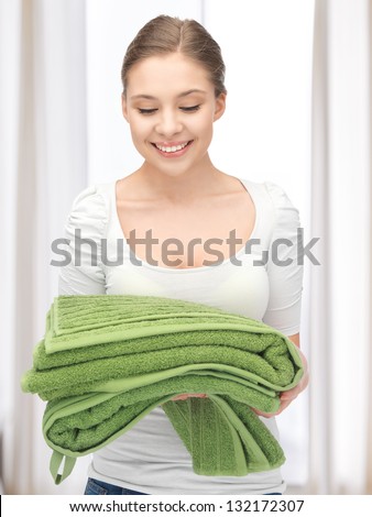 bright picture of lovely housewife with towels