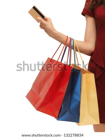 closeup or picture of woman with shopping bags .