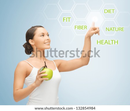 woman holding apple and working with virtual screen